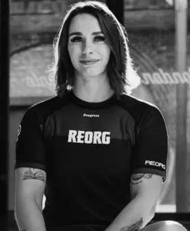 Ffion Davies seated wearing a REORG training shirt