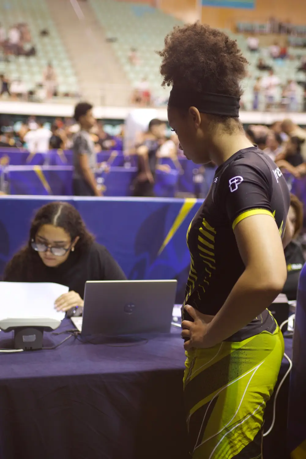 Naimah David standing beside the officials table at the 2026 IBJJF European Kids No-Gi Championships in Lisbon