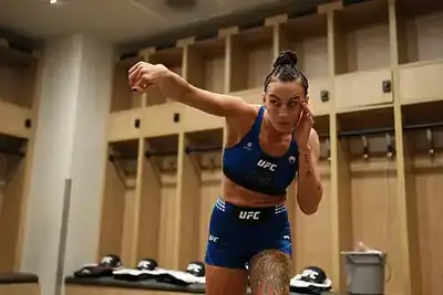 Kickboxer practising striking movement during a training warm-up